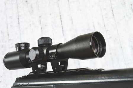 air rifle with an optical sight on a light backgroundの写真素材