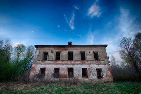 old, worn, abandoned collapsing building ready for demolitionの写真素材