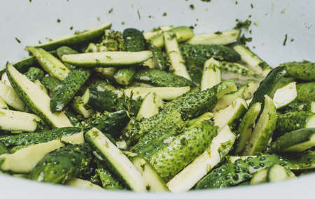 Cucumber salad in its own juice. pickled for packaging in jars for long-term storageの写真素材