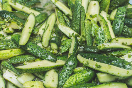 Cucumber salad in its own juice. pickled for packaging in jars for long-term storageの写真素材