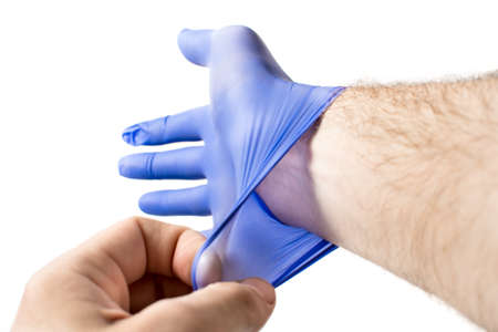 a man wears blue protective medical gloves, protection during a pandemic