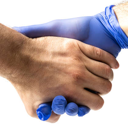 a man wears blue protective medical gloves, protection during a pandemicの写真素材