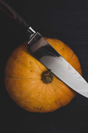 A pumpkin cooked to make a halloween lantern, and a sharp knife for making a face, Jack Lantern, Halloween attributeの写真素材