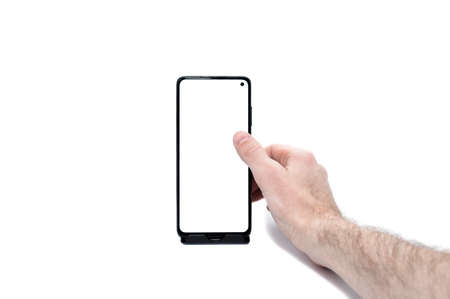 man holds, operates fingers smartphone with blank screen on white backgroundの写真素材