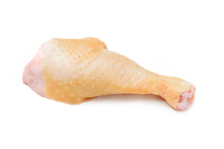 Raw chicken leg isolated on a white backgroundの写真素材