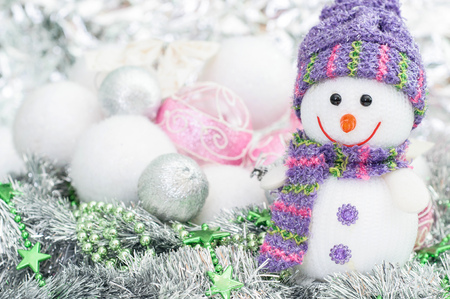 Snowman on the background of Christmas ballsの写真素材