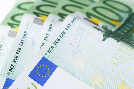 100 Euro banknotes isolated on white background