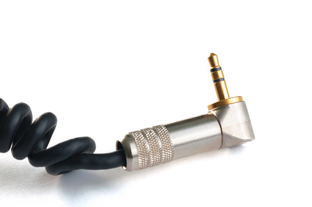 Professional audio instrumental cable with 3.5mm gold stereo plug isolated on white close up