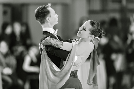 Bila Tserkva, Ukraine. February 22, 2013 International open dance sport competition Stars of Ukraine 2013. Couple dancing valz in ballroom isolated. Black and white photographyのeditorial素材