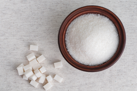 Bowl of white granulated sugar and refined sugar, top viewの写真素材