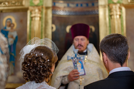 Bila Tserkva, Ukraine. October 5, 2012 A wedding ceremony in the Orthodox city Church. Newlywed couple in front of Church altarのeditorial素材