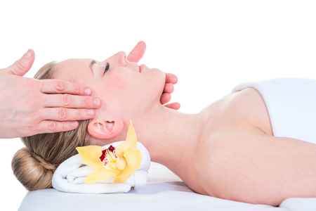 Woman receiving a head massage in spa.の写真素材