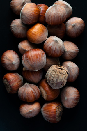 Stack of hazelnuts from above. Closeup top viewの写真素材