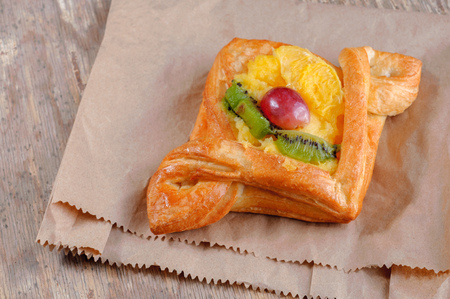 sweet bun with orange kiwi and grapesの写真素材