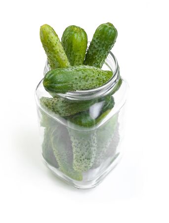cucumbers prepared for preservation in a glass jarの写真素材