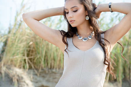 Professional photo session of beautiful young european woman on the beachの写真素材