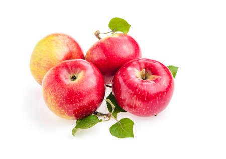 closeup red apples with green leaves isolate on white background.の写真素材