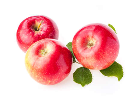 ripe red apples with leaves isolate on white backgroundの写真素材