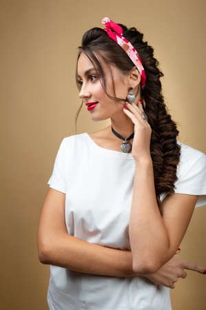 young woman in luxury silver jewelry posingの写真素材