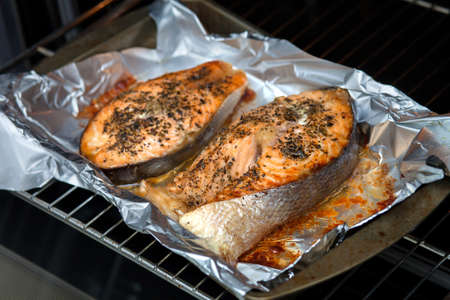 Oven salmon steaks. Two red slices of red fish with spices.の写真素材
