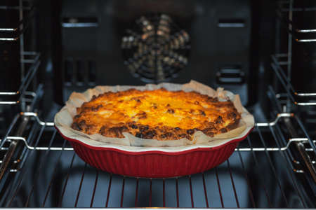 Oven baked cottage cheese casserole. In red baking dishの写真素材