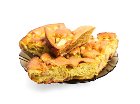 apple pie on a plate cut in chunks