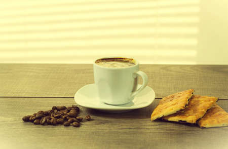 cup of coffee near the windowの写真素材