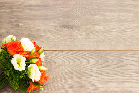 bouquet of flowers on a wooden backgroundの写真素材