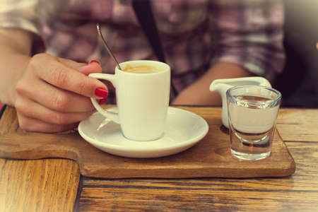 Female hands and coffee cup の写真素材