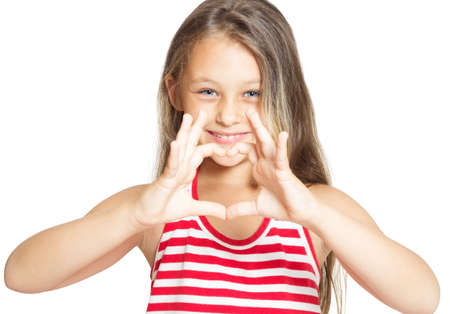little girl showing heart handsの写真素材