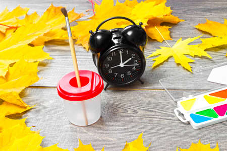 school supplies on the background of autumnの写真素材