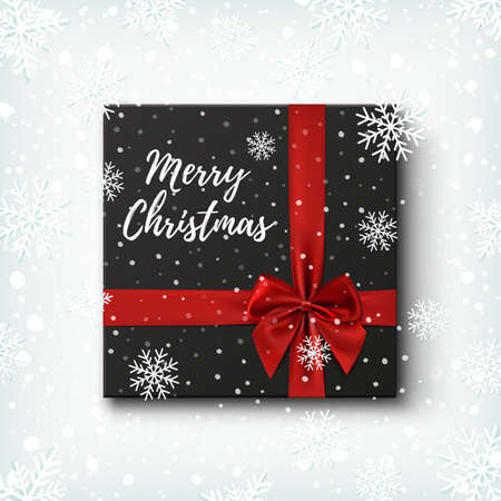 Merry Christmas greeting card template. Realistic black gift icon, top view on winter background with snow and snowflakes. Vector illustration.のイラスト素材