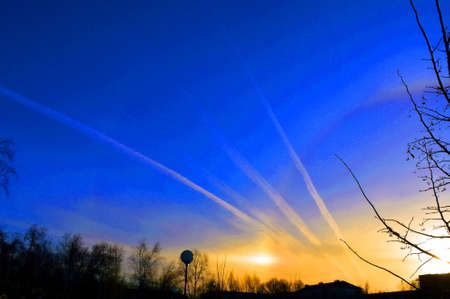 traces of airplanes on a blue skyの写真素材