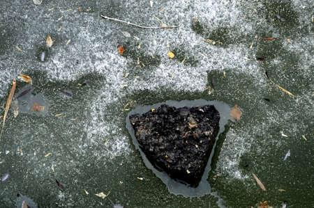 a stone frozen in the ice