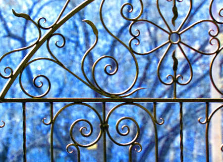 detail of iron patterned gate on a blurred backgroundの写真素材