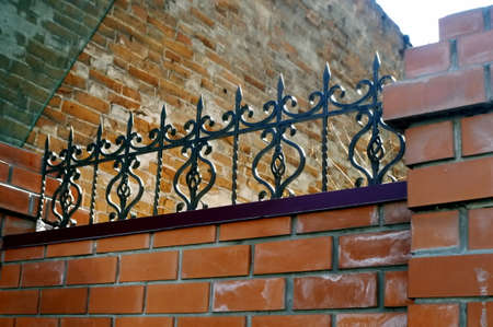 brick wall part with cast ironの写真素材