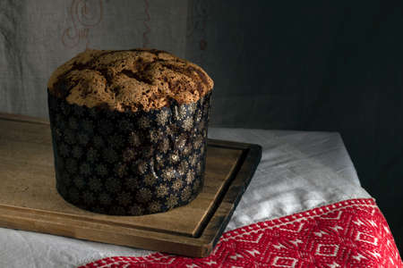 Easter cake on a wooden Board and patterned tablecloth 5の写真素材