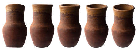 old Slavic earthenware pot with hard light in different angles from the sideの写真素材