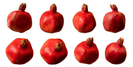 Ripe red pomegranate in various angles on a white backgroundの写真素材
