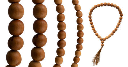 Wooden old Prayer beads with a large view of beads in various angles on a white backgroundの写真素材