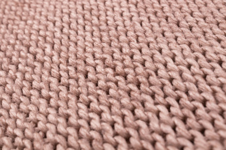 Beautiful wrong side neatly arranged on a knitted woolen cloth
