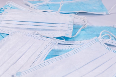 close up photo of a pile of medical masks