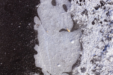 frozen puddle, in which there is a cavity with air, still intact