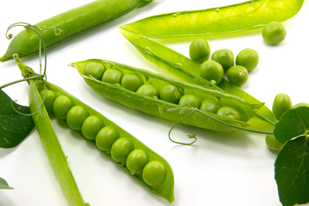 Green peas on a white background isolationの写真素材