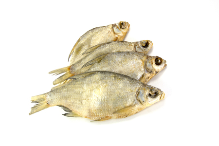 Dry salted fishes isolated on a white backgroundの写真素材