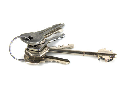 Bunch of keys on a white backgroundの写真素材