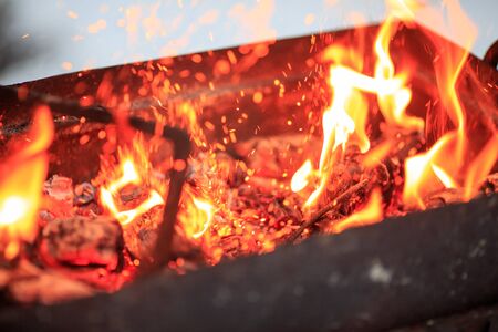 Flames from the brazier of coals from close up.