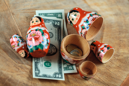 Matryoshka. Russian doll with dollars. Anti crisis money box. Matrioska bank.の写真素材