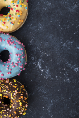 Flat lay of colorful donuts. Background. Copyspaceの写真素材