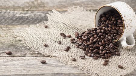 Copyspace with full coffee cup of coffee beans.の写真素材